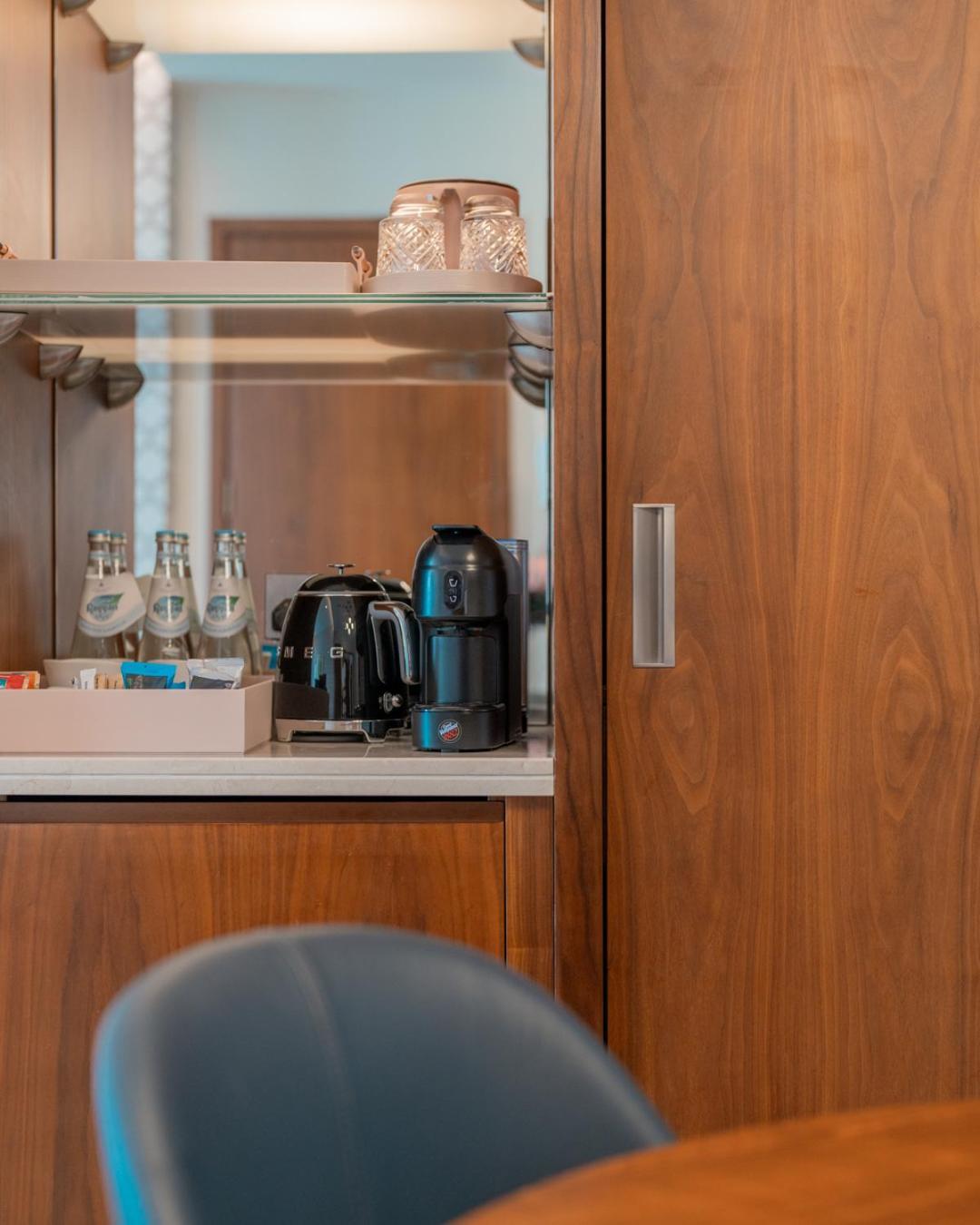 Abesq Doha Hotel And Residences, An Ihg Hotel Ngoại thất bức ảnh A Nespresso machine on board a plane